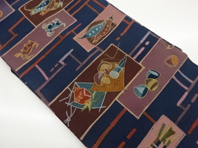 Nagoya obi with fish, crab, and vegetable patterns in gold-colored horizontal st